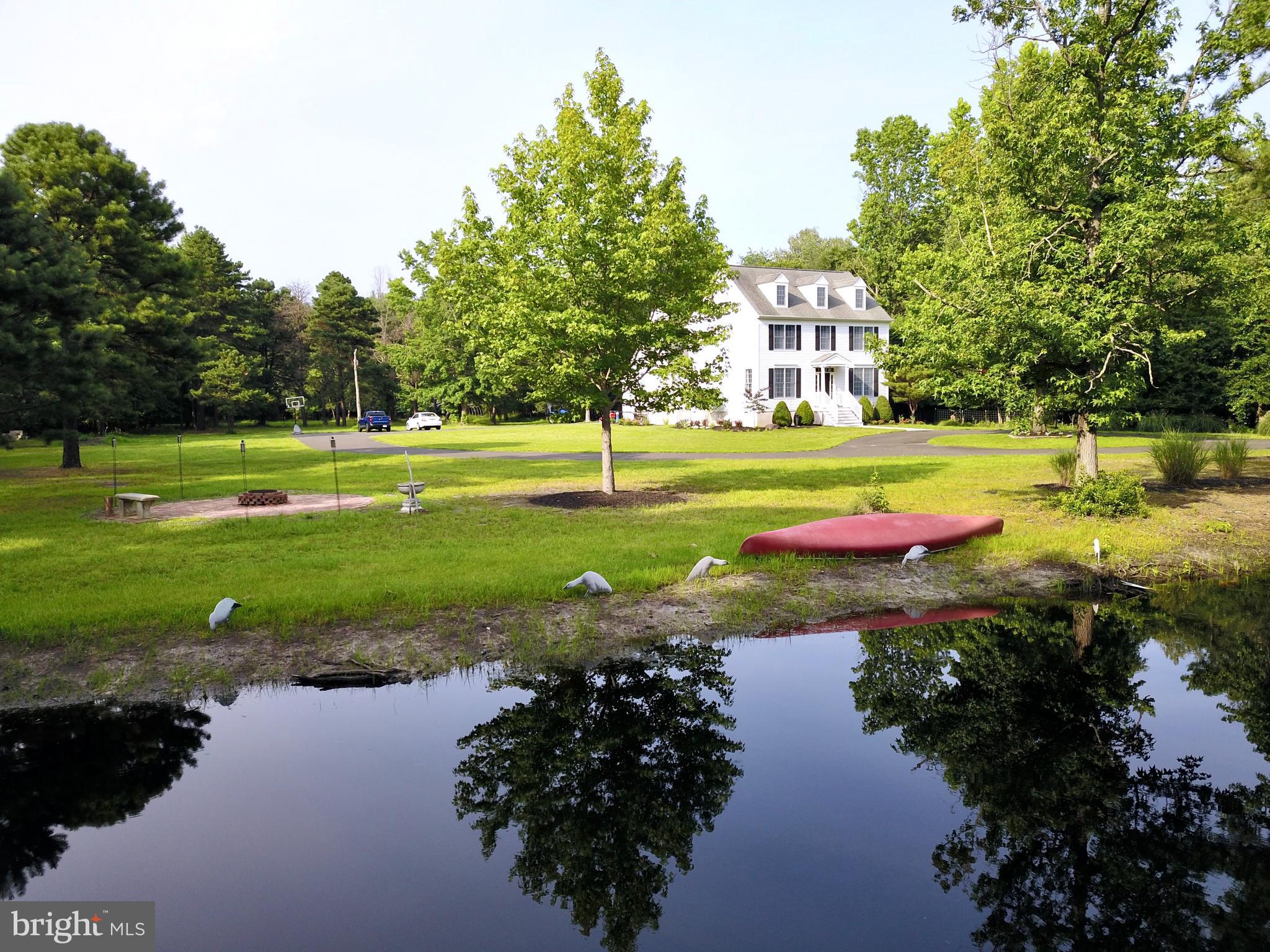 100 Jackson Road Medford, NJ 08055 - Photo 1 of 45 a view of a lake with houses and lake view
