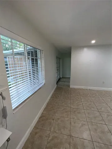 a view of hallway with windows
