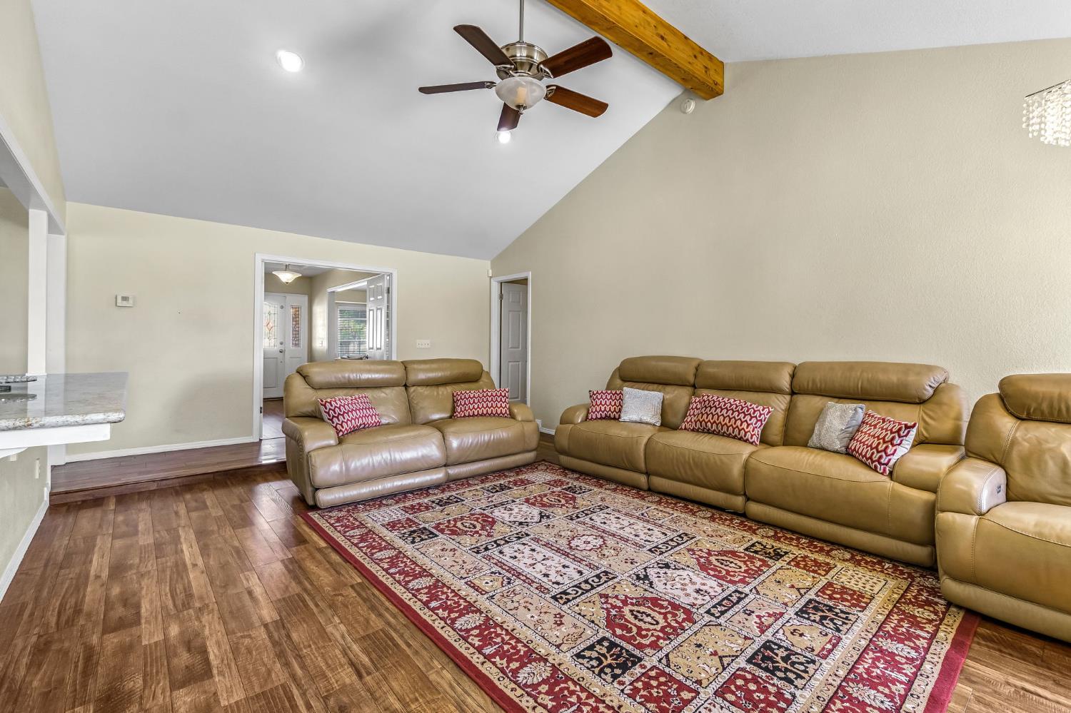 2436 Trevor Court Madera, CA 93637 - Photo 11 of 57 a living room with a couch and a rug