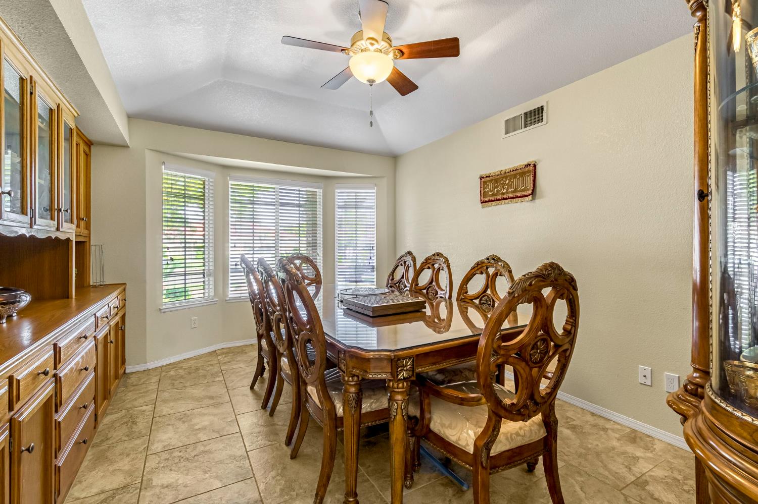 2436 Trevor Court Madera, CA 93637 - Photo 20 of 57 a view of a dining room with furniture and a window