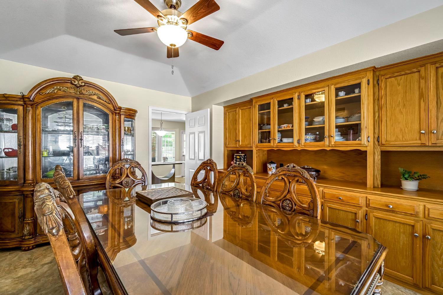 2436 Trevor Court Madera, CA 93637 - Photo 21 of 57 a view of a dining room with furniture window and wooden floor