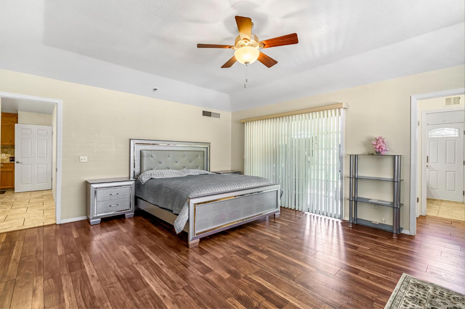 2436 Trevor Court Madera, CA 93637 - Photo 25 of 57 a bedroom with a bed and wooden floor