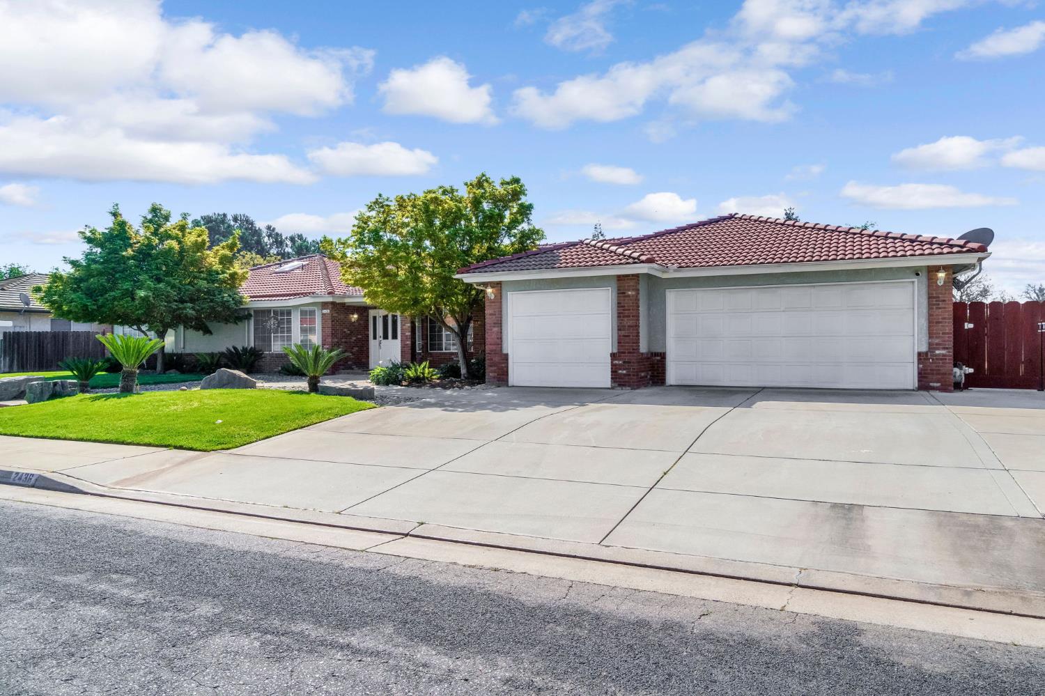 2436 Trevor Court Madera, CA 93637 - Photo 3 of 57 a front view of house with yard