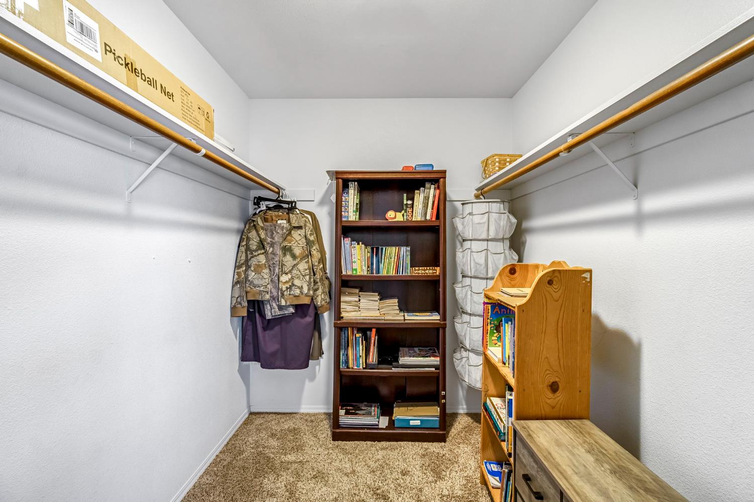 2436 Trevor Court Madera, CA 93637 - Photo 34 of 57 a view of walk in closet with clothes and shoes