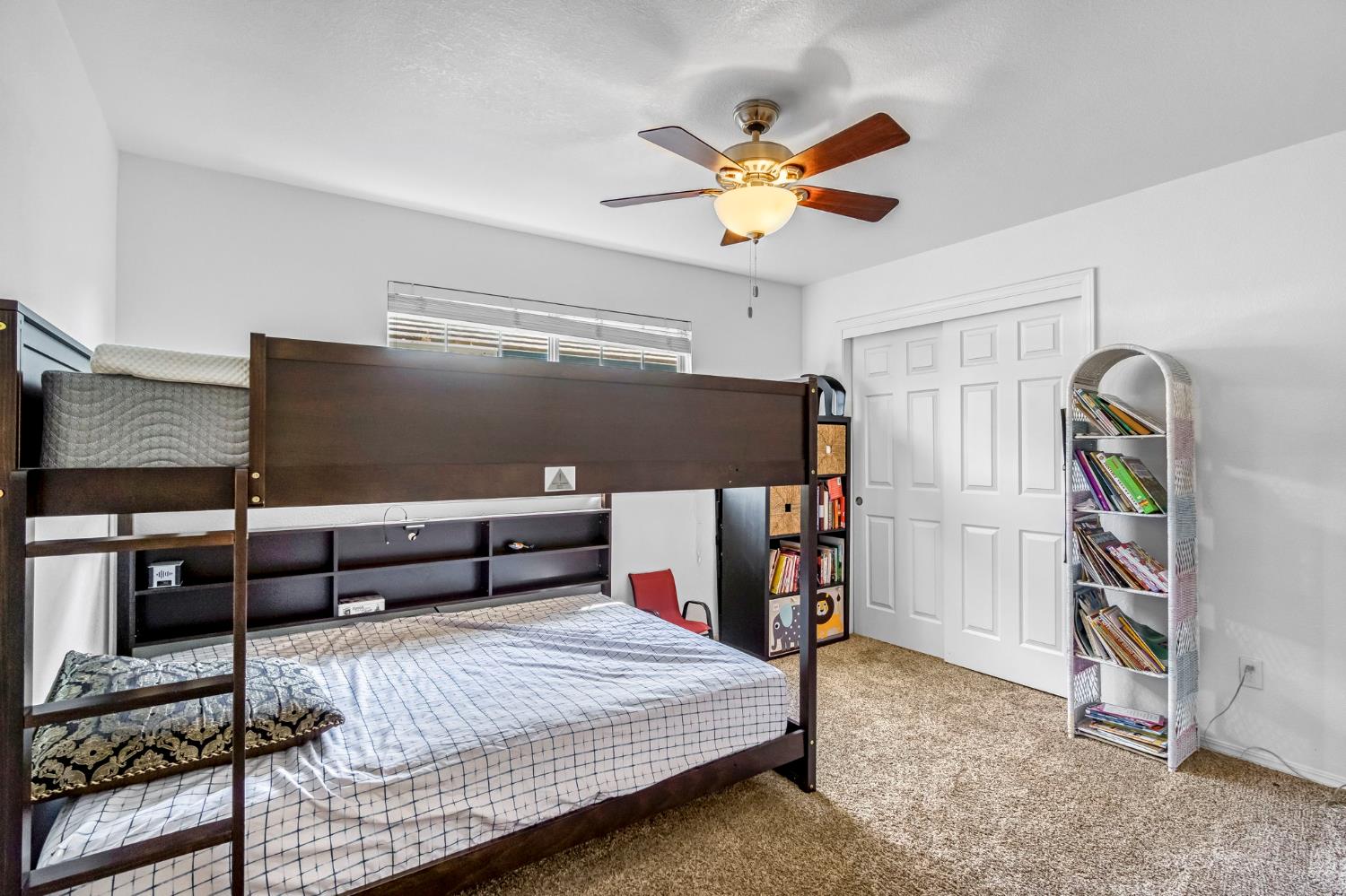 2436 Trevor Court Madera, CA 93637 - Photo 35 of 57 a bedroom with a bed and a chandelier