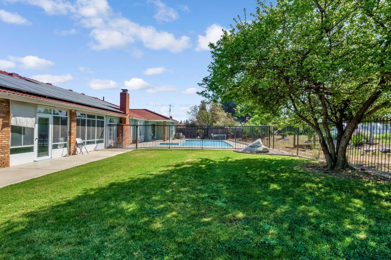 2436 Trevor Court Madera, CA 93637 - Photo 47 of 57 a view of a house with a swimming pool