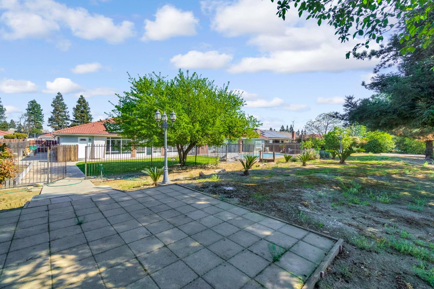 2436 Trevor Court Madera, CA 93637 - Photo 49 of 57 a view of yard with swimming pool and outdoor seating