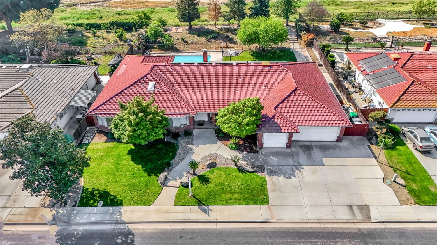 2436 Trevor Court Madera, CA 93637 - Photo 53 of 57 an aerial view of a house with a yard and potted plants
