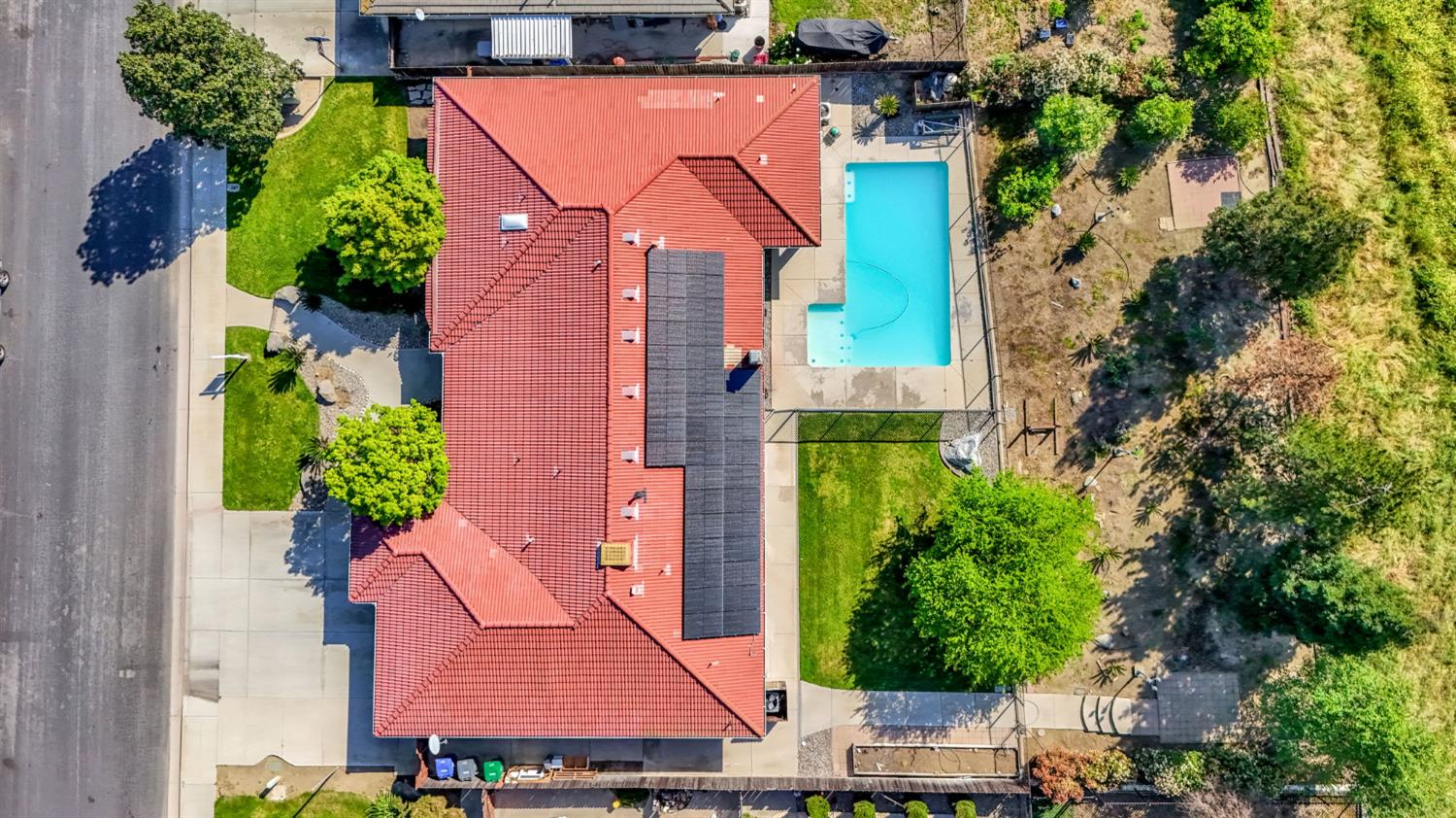 2436 Trevor Court Madera, CA 93637 - Photo 55 of 57 an aerial view of a house with a garden