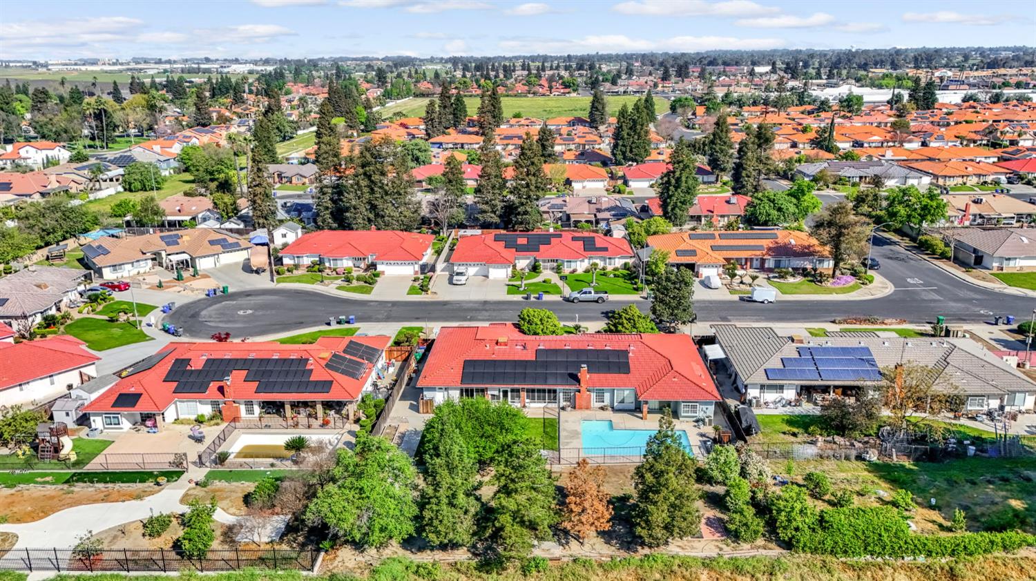 2436 Trevor Court Madera, CA 93637 - Photo 57 of 57 an aerial view of residential houses with outdoor space