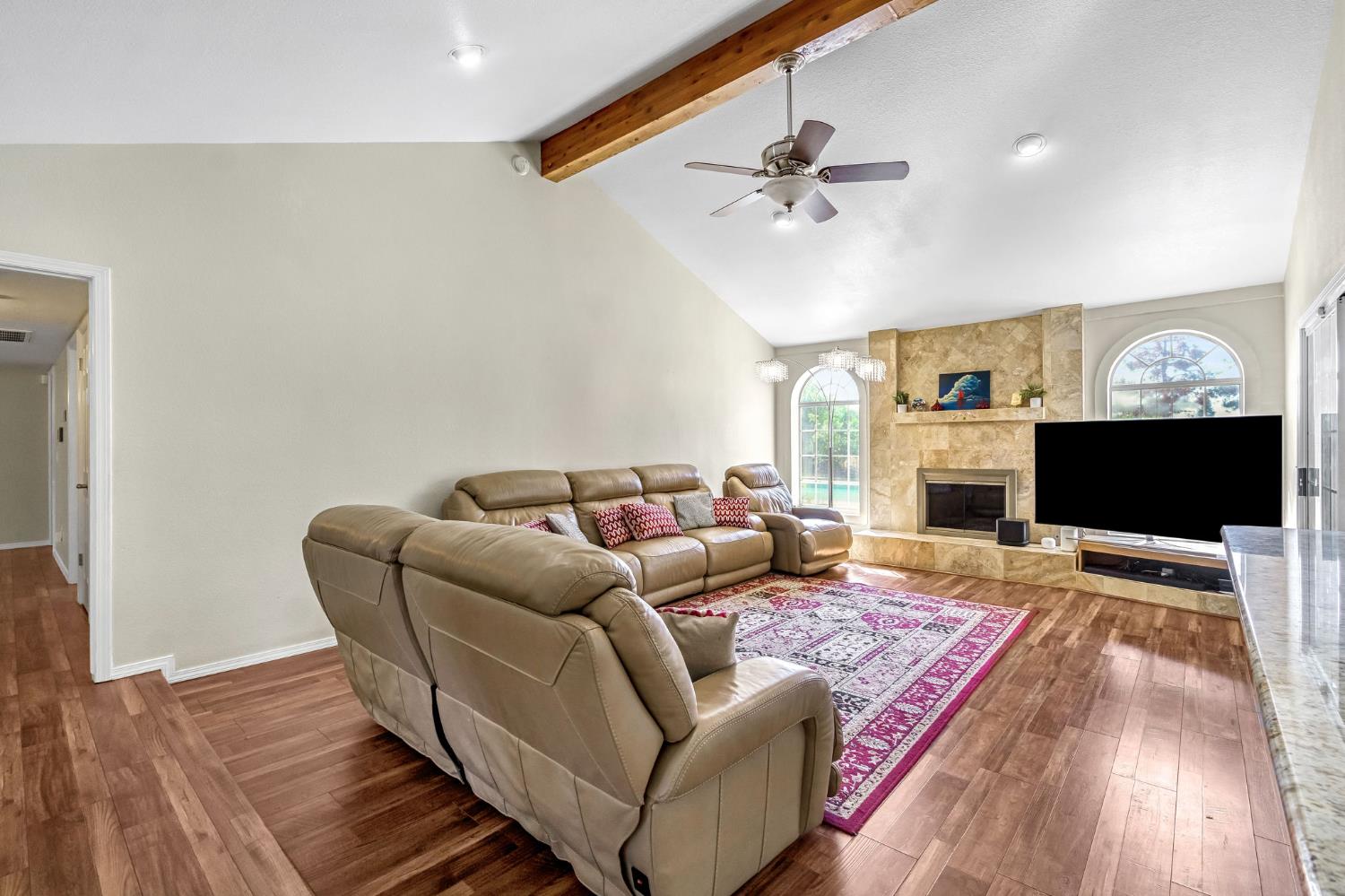 2436 Trevor Court Madera, CA 93637 - Photo 9 of 57 a living room with furniture and a flat screen tv