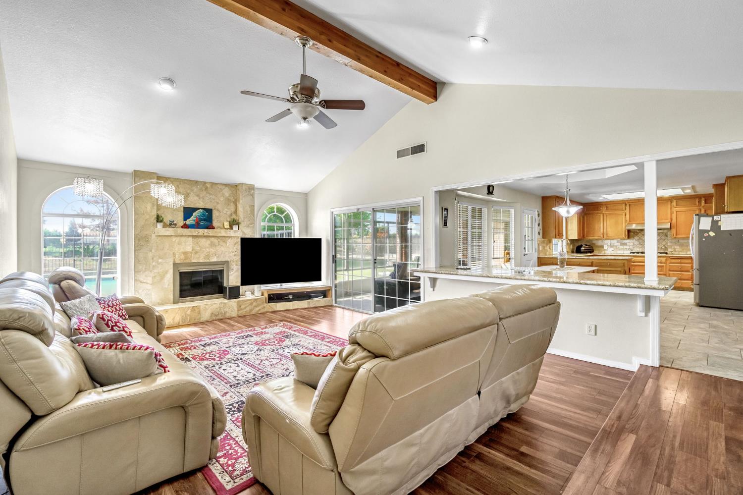 2436 Trevor Court Madera, CA 93637 - Photo 10 of 57 a living room with furniture and a flat screen tv