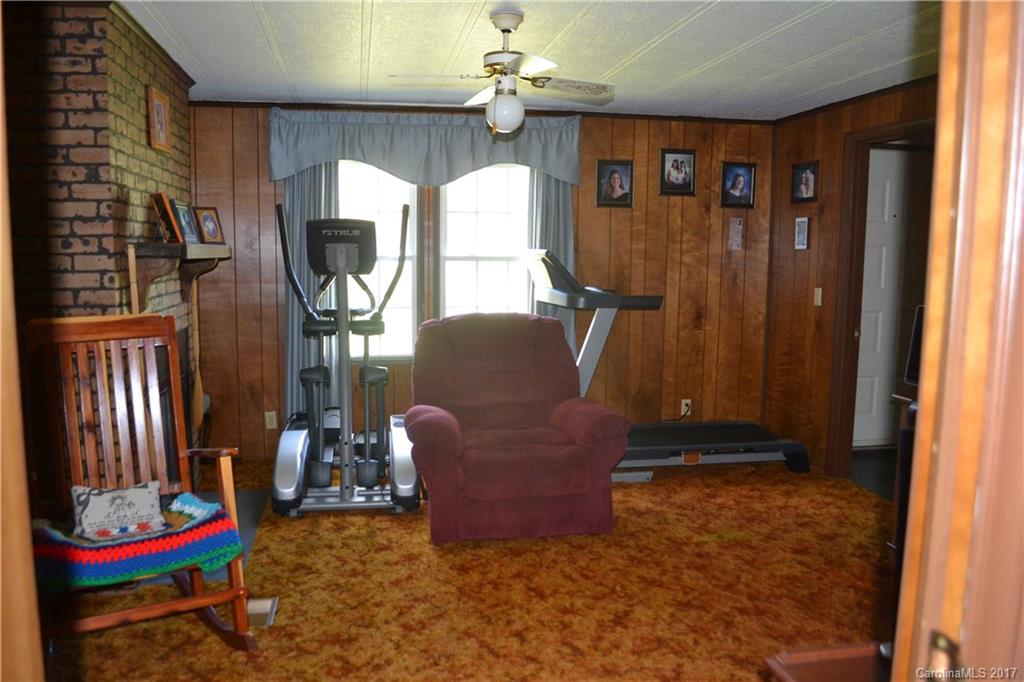 156 Tommy Howell Road Canton, NC 28716 - Photo 22 of 24 a living room with furniture and a fireplace