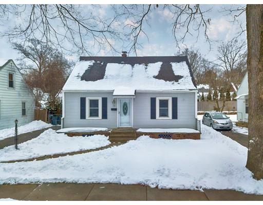 159 Powell Avenue Springfield, MA 01118 - Photo 1 of 30 a front view of a house with a yard and garage