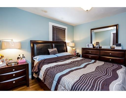 159 Powell Avenue Springfield, MA 01118 - Photo 11 of 30 a bedroom with a bed and a large mirror