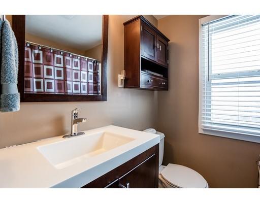 159 Powell Avenue Springfield, MA 01118 - Photo 13 of 30 a kitchen with a sink cabinets and a window