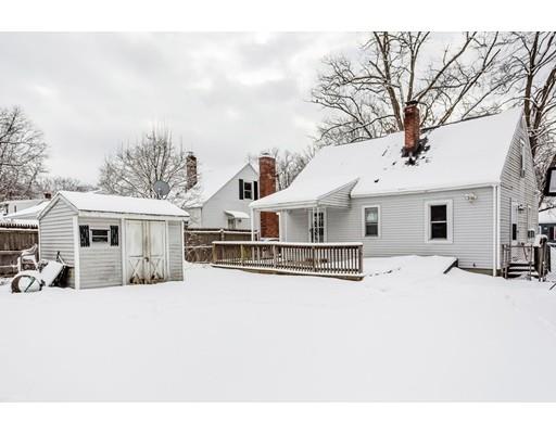 159 Powell Avenue Springfield, MA 01118 - Photo 25 of 30 a white house that has a tree in front of it