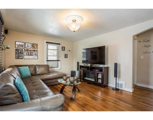 159 Powell Avenue Springfield, MA 01118 - Photo 3 of 30 a living room with furniture and a flat screen tv