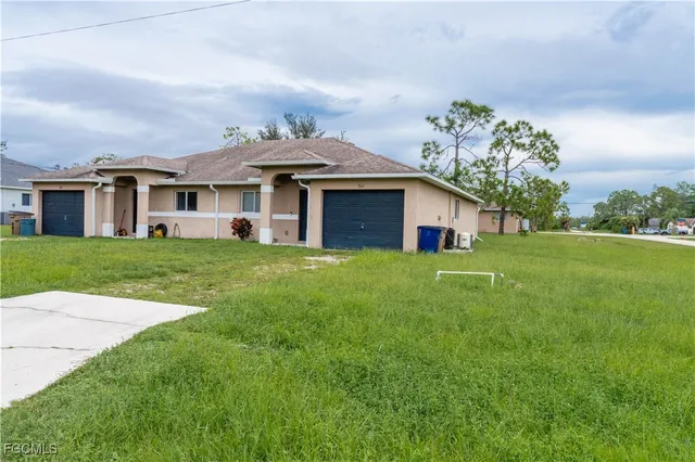 a front view of house with yard and green space