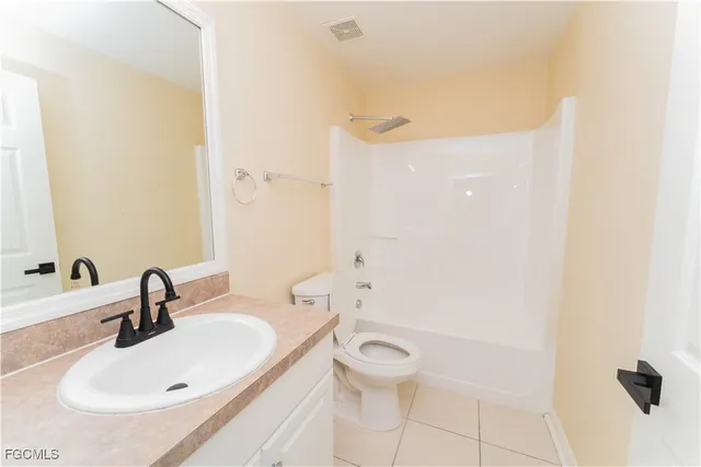 a large white kitchen with cabinets and white appliances