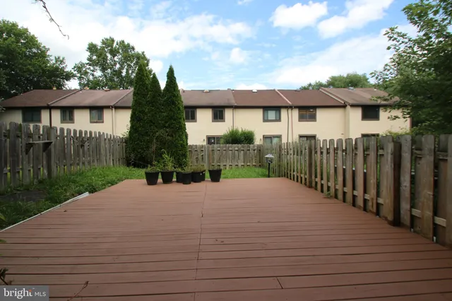 a front view of a house with yard and green space