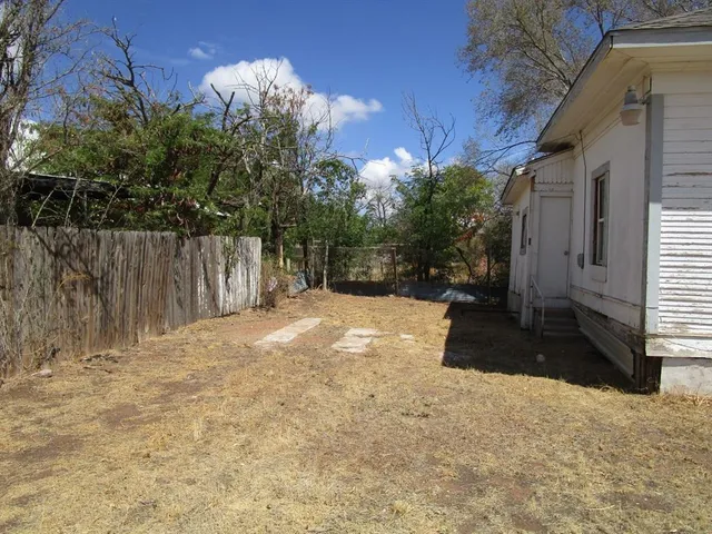 a view of a backyard of the house