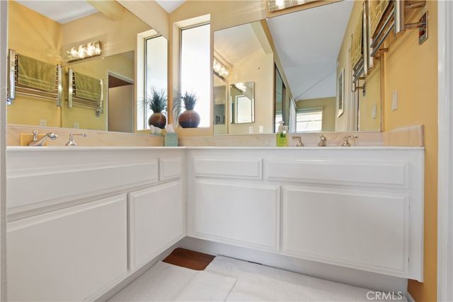 a bathroom with a sink and mirror