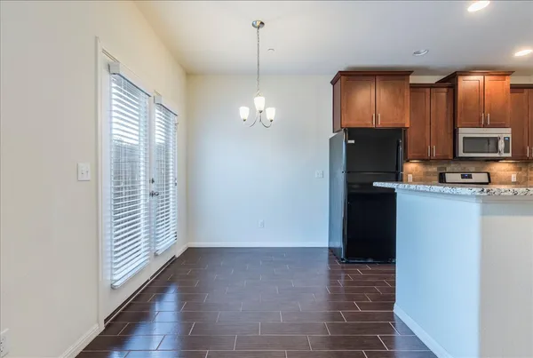 a view of a kitchen from the hallway