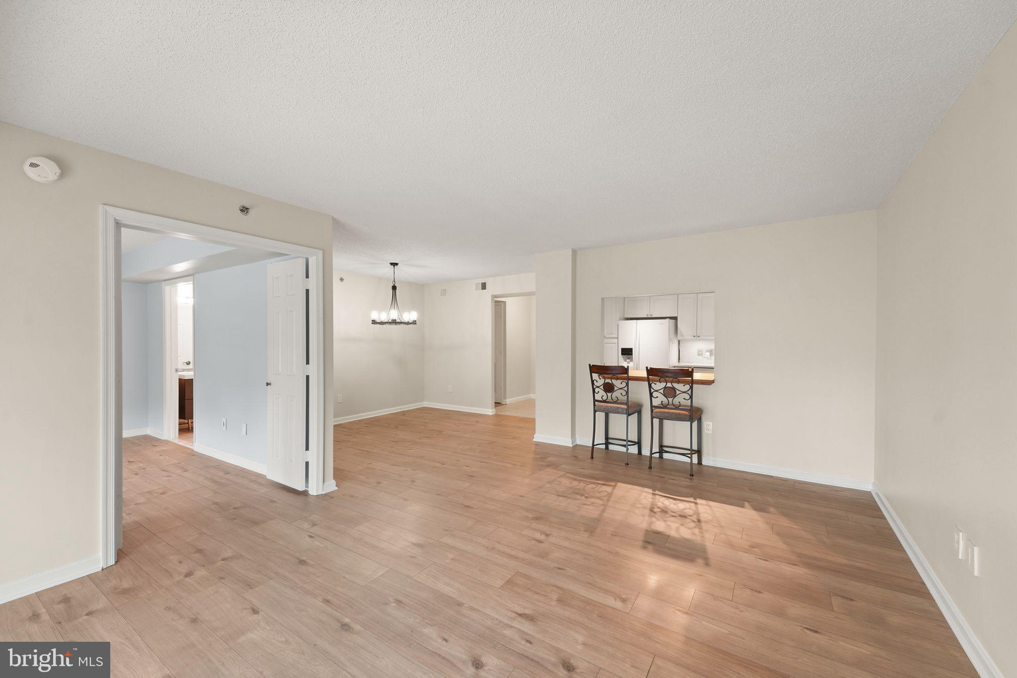 19385 Cypress Ridge Terrace, Unit 522 Leesburg, VA 20176 - Photo 16 of 33 a view of empty room with kitchen and window