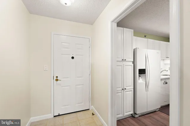 a view of a bathroom with a glass shower door
