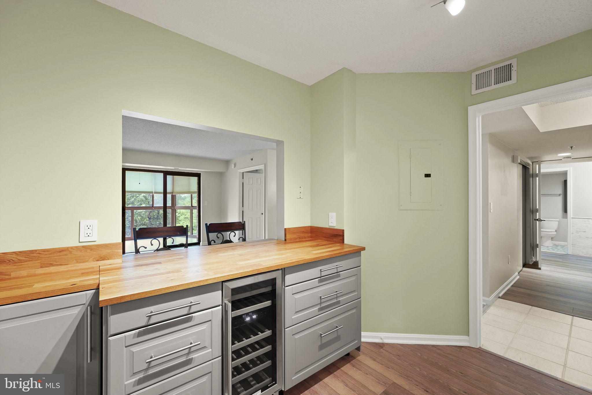 19385 Cypress Ridge Terrace, Unit 522 Leesburg, VA 20176 - Photo 7 of 33 a bathroom with a granite countertop sink and a mirror
