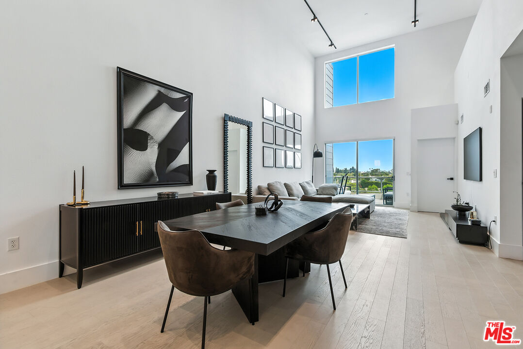 4211 Redwood Avenue, Unit 402 Los Angeles, CA 90066 - Photo 2 of 33 a dining room with furniture and window