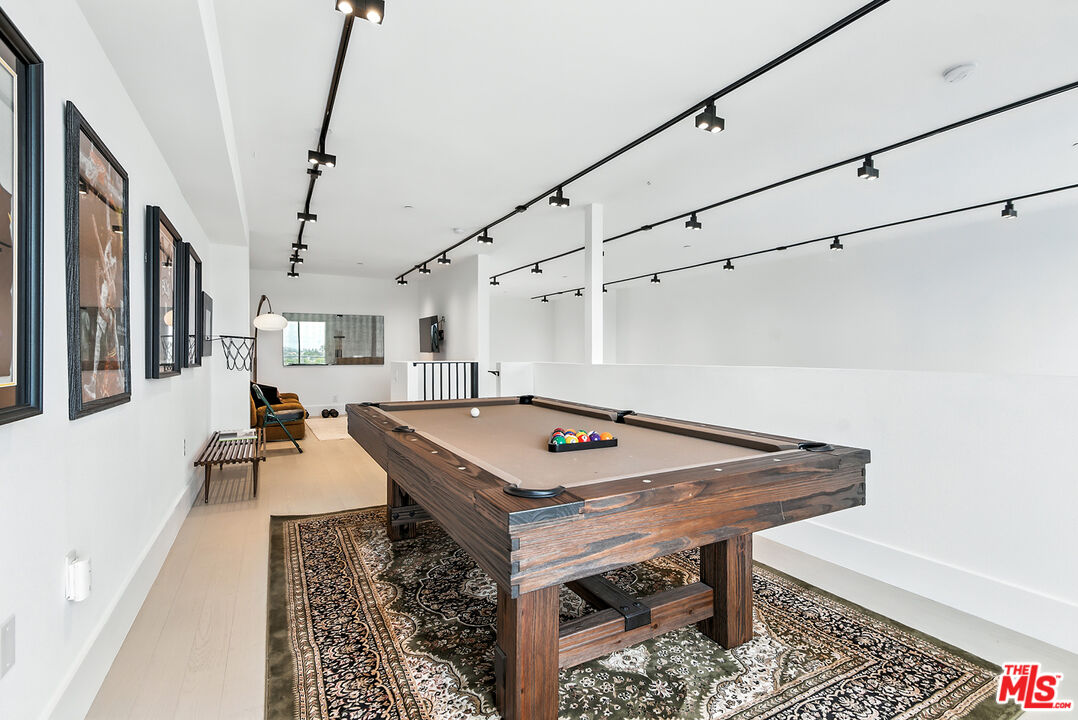 4211 Redwood Avenue, Unit 402 Los Angeles, CA 90066 - Photo 25 of 33 a view of a room with furniture and wooden floor