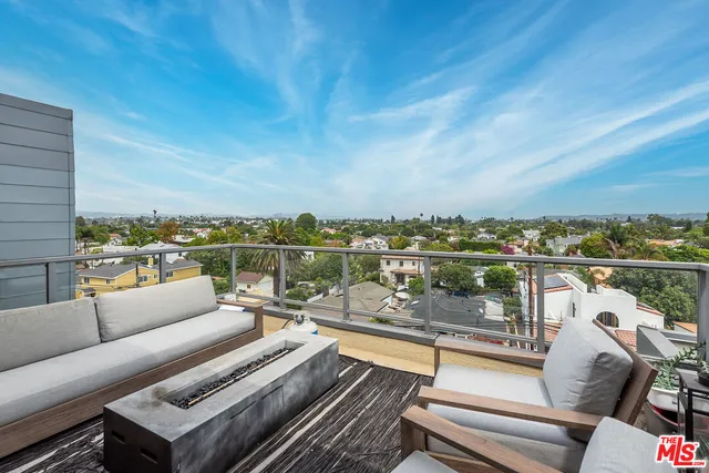 a view of a balcony with city view