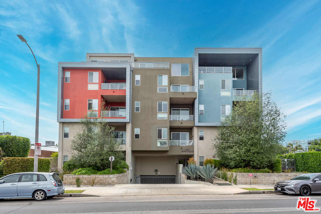 4211 Redwood Avenue, Unit 402 Los Angeles, CA 90066 - Photo 31 of 33 a view of a car parked in front of a building