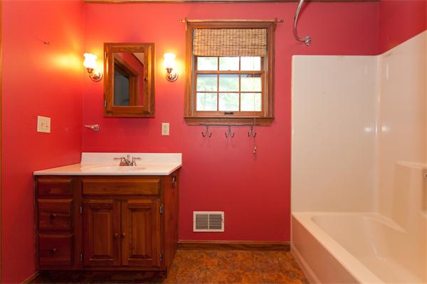 66 Baker Road Salisbury, MA 01952 - Photo 15 of 22 a bathroom with a granite countertop sink and a bathtub