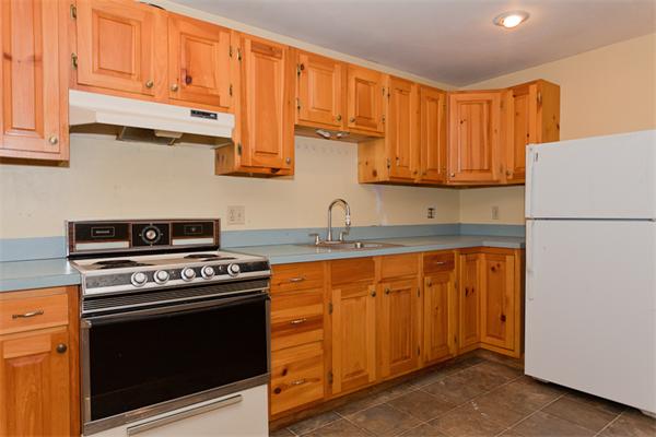 66 Baker Road Salisbury, MA 01952 - Photo 20 of 22 a kitchen with stainless steel appliances granite countertop a stove a refrigerator and a sink