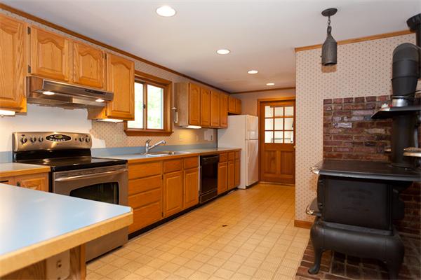 66 Baker Road Salisbury, MA 01952 - Photo 2 of 22 a kitchen with stainless steel appliances granite countertop a sink stove and refrigerator