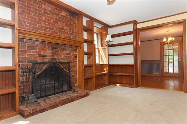 66 Baker Road Salisbury, MA 01952 - Photo 6 of 22 a view of an empty room with a fireplace and a window