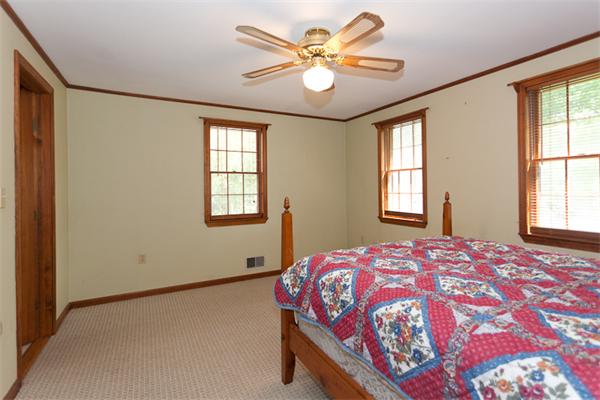 66 Baker Road Salisbury, MA 01952 - Photo 8 of 22 a bedroom with a bed and a window