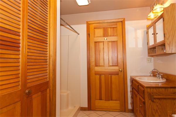 66 Baker Road Salisbury, MA 01952 - Photo 9 of 22 a bathroom with a sink a mirror and a shower