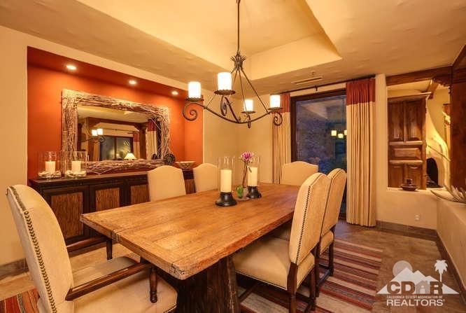 72275 Upper Way West Palm Desert, CA 92260 - Photo 14 of 90 a view of a dining room with furniture and a chandelier