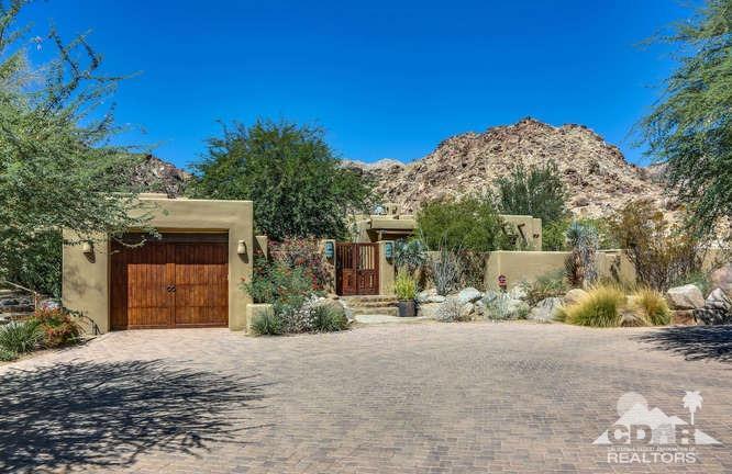 72275 Upper Way West Palm Desert, CA 92260 - Photo 27 of 90 a front view of a house with a yard and garage