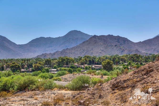 72275 Upper Way West Palm Desert, CA 92260 - Photo 28 of 90 a view of a lush green hillside and a building