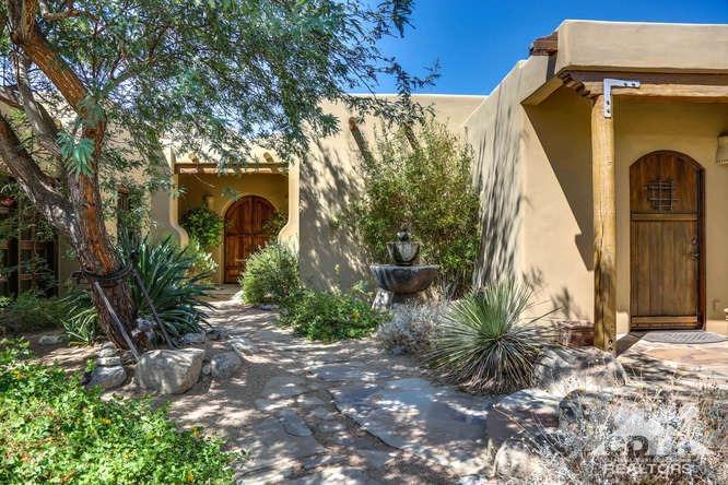 72275 Upper Way West Palm Desert, CA 92260 - Photo 32 of 90 a front view of a house with garden