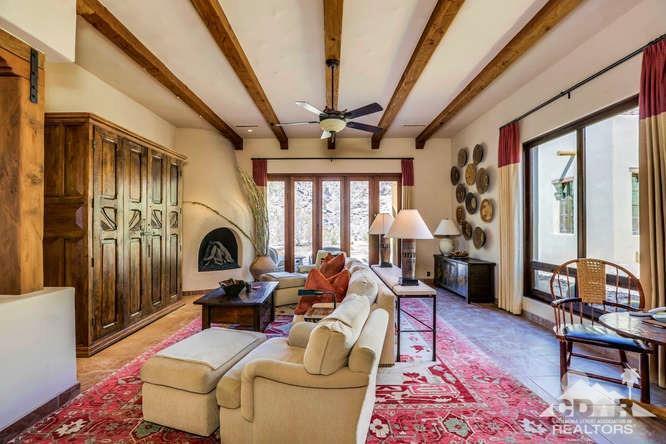 72275 Upper Way West Palm Desert, CA 92260 - Photo 36 of 90 a living room with fireplace furniture and a large window