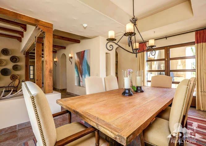 72275 Upper Way West Palm Desert, CA 92260 - Photo 41 of 90 a dining room with a table chairs and wooden floor