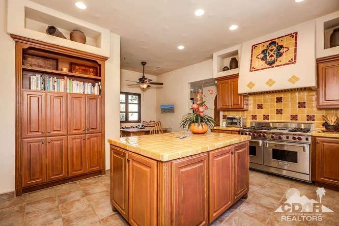 72275 Upper Way West Palm Desert, CA 92260 - Photo 44 of 90 a kitchen with stainless steel appliances granite countertop a refrigerator and a stove top oven
