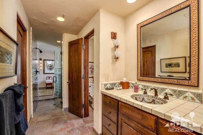 72275 Upper Way West Palm Desert, CA 92260 - Photo 49 of 90 a bathroom with a sink and a mirror