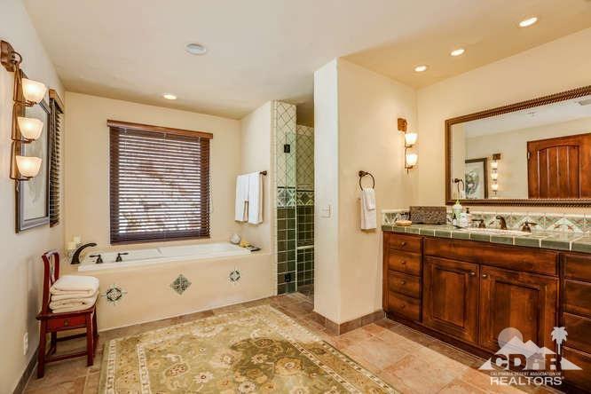 72275 Upper Way West Palm Desert, CA 92260 - Photo 51 of 90 a bathroom with a tub sink and mirror